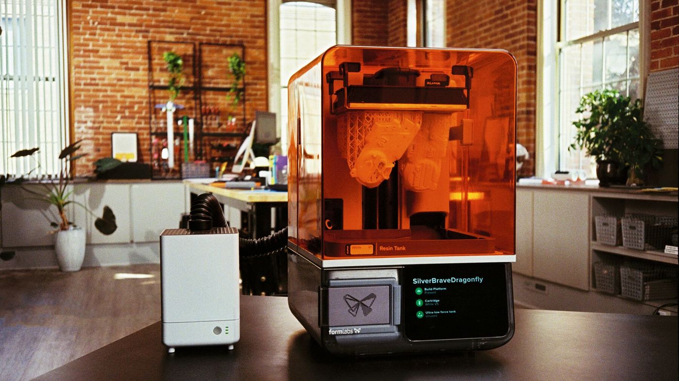 Form Studio 1 printing a part on a desk in a bright office