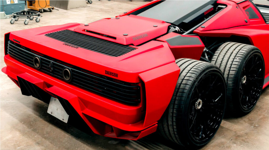Red custom six-wheel supercar with black wheels