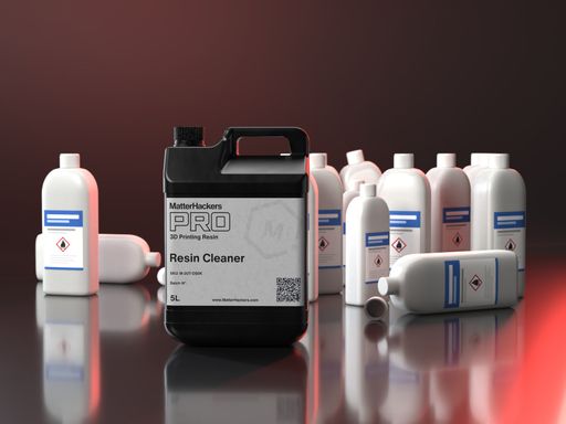 One 5 liter jug of PRO Resin Wash in front of a pile of empty isopropyl alcohol bottles