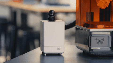 A VOC Extractor sits beside a Form Studio 1 as it prints