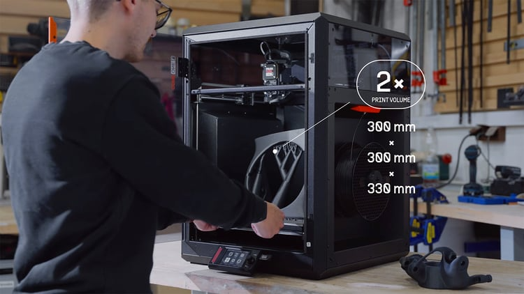 A large printed part is on the 300 by 300 millimeter build plate of the Prusa CORE One L, highlighting its large build volume capabilities perfect for large parts, as well as batch 3D printing.