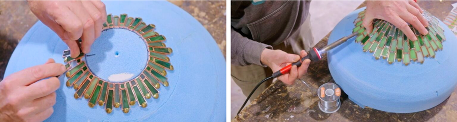 Soldering copper-framed glass pieces onto a blue 3D printed dome