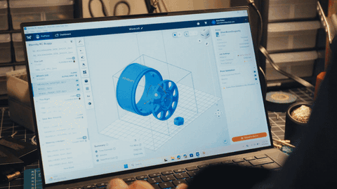 PreForm on a laptop orients a model and adds supports automatically