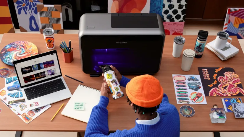 eufyMake E1 UV printer on a desk in a creator's studio