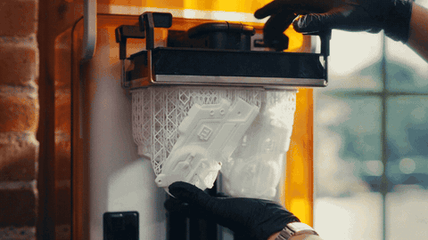 Hands flex the Build Platform Flex and resin parts pop free