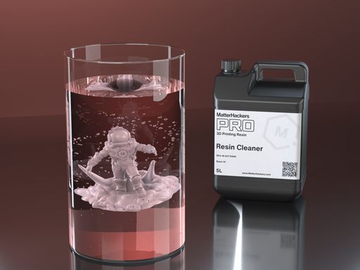 Resin miniature washing in a swirling glass of PRO Resin Wash, next to the 5 liter jug